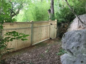 A decorative, wooden, privacy, residential fence with a foot of lattice at the top built by trusted Chattanooga fence company All Fences Co.